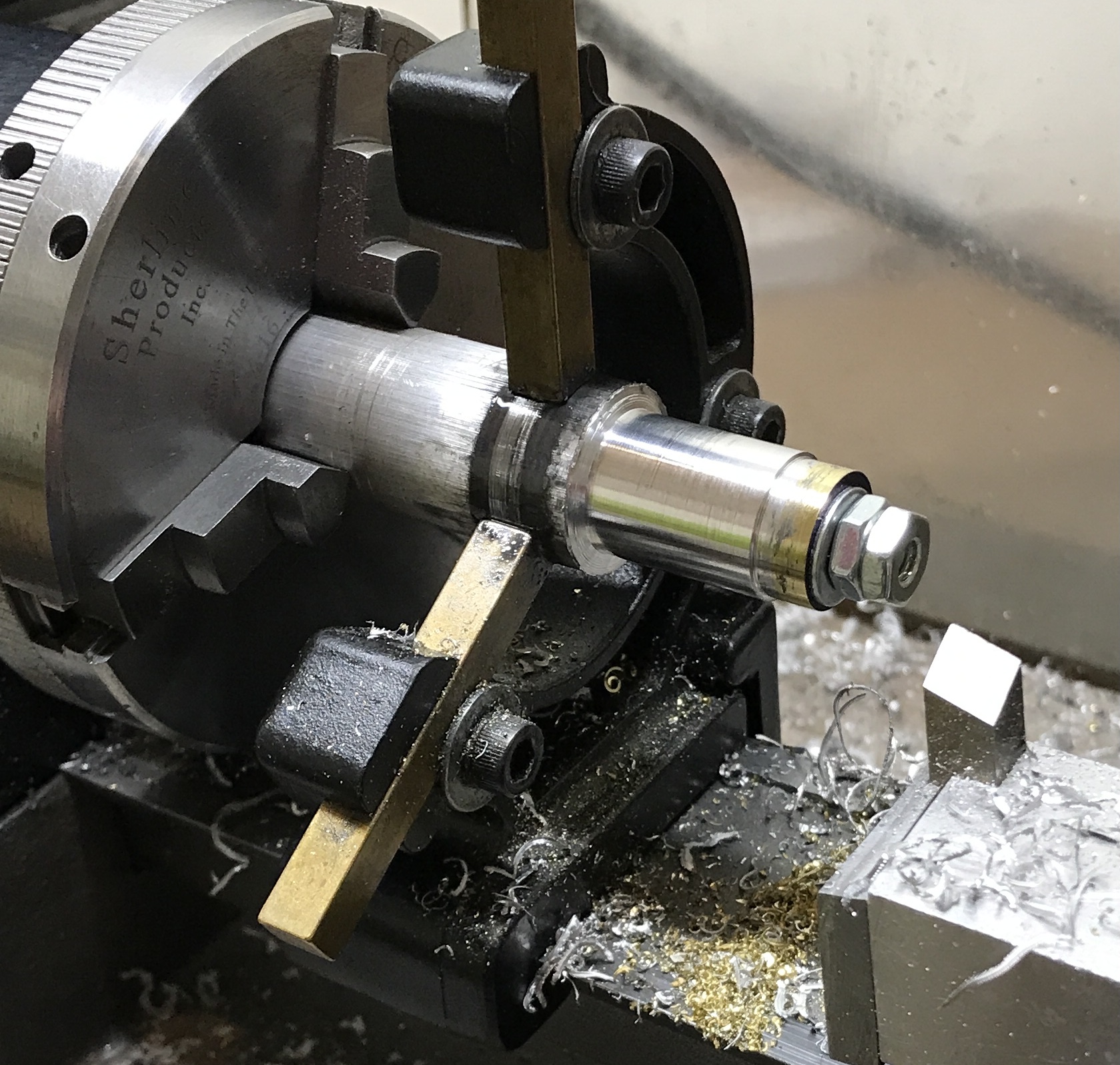 The mandrel with planetary gear blanks in place